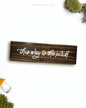 Dark brown wooden sign with 'this way to the porch' text written on it, lying on a white background